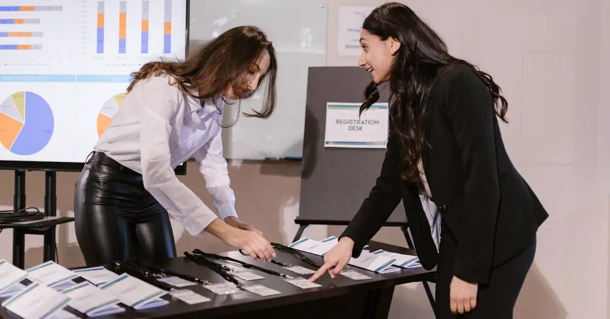 two women arranging name badges at a registration desk during a corporate event